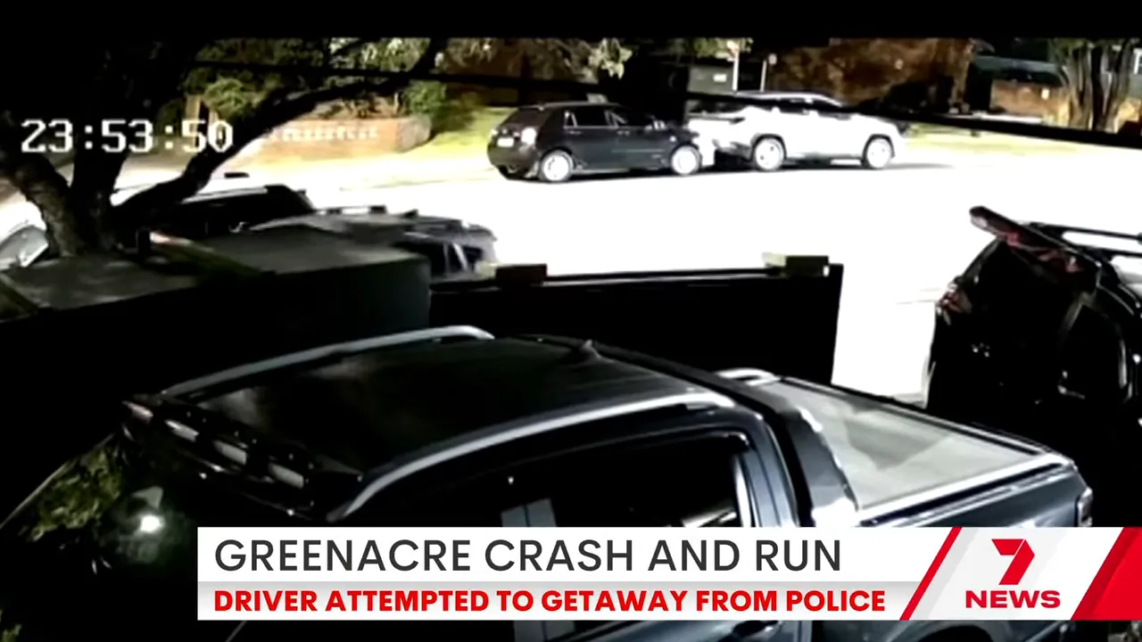 Timestamped CCTV-style frame showing vehicles at the Greenacre crash and run scene