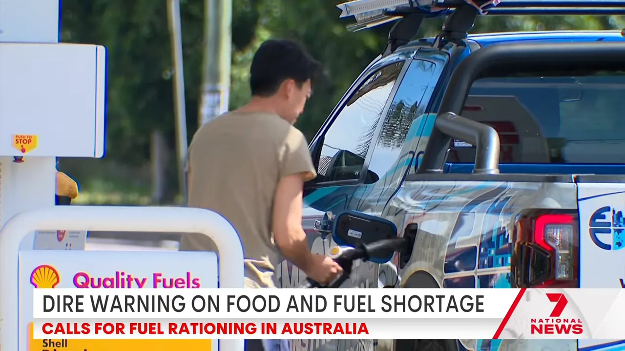 Man refuelling a vehicle/truck at a fuel station amid warnings of possible fuel rationing in Australia