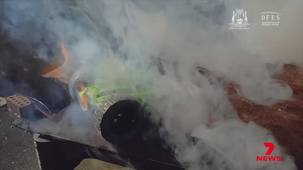 Lithium-ion battery emitting smoke and small flames during a thermal-runaway demonstration