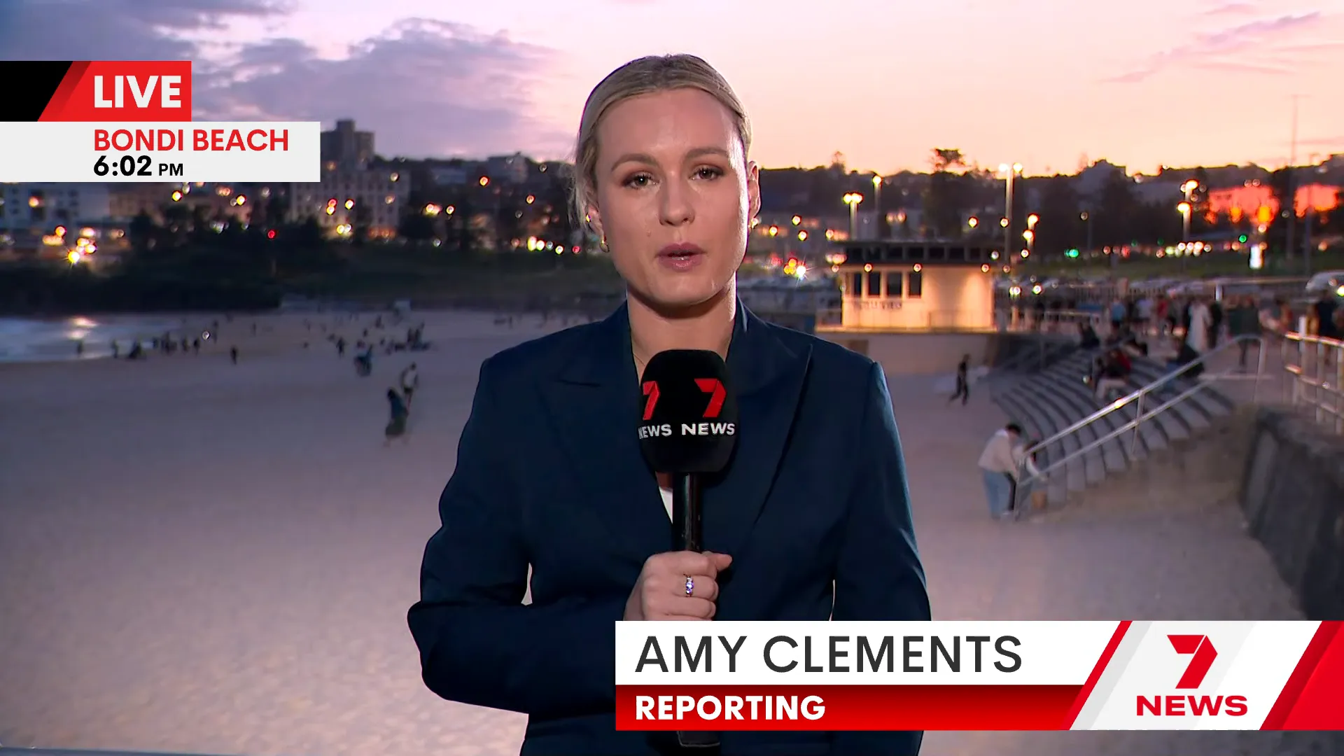 Protesters and counter-protesters exchange words as police watch on