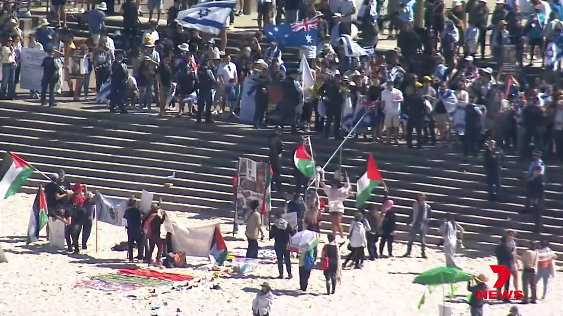 Standoff between rival protesters with flags visible