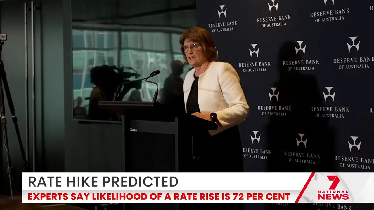 Speaker at a podium in front of Reserve Bank of Australia branded backdrop
