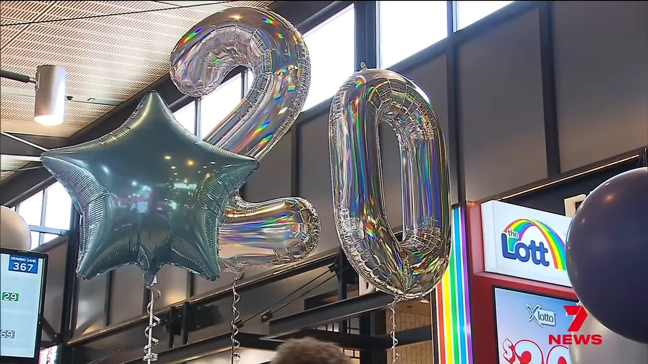 Silver number 20 balloons and The Lott sign above the lottery kiosk celebrating the $20 million prize