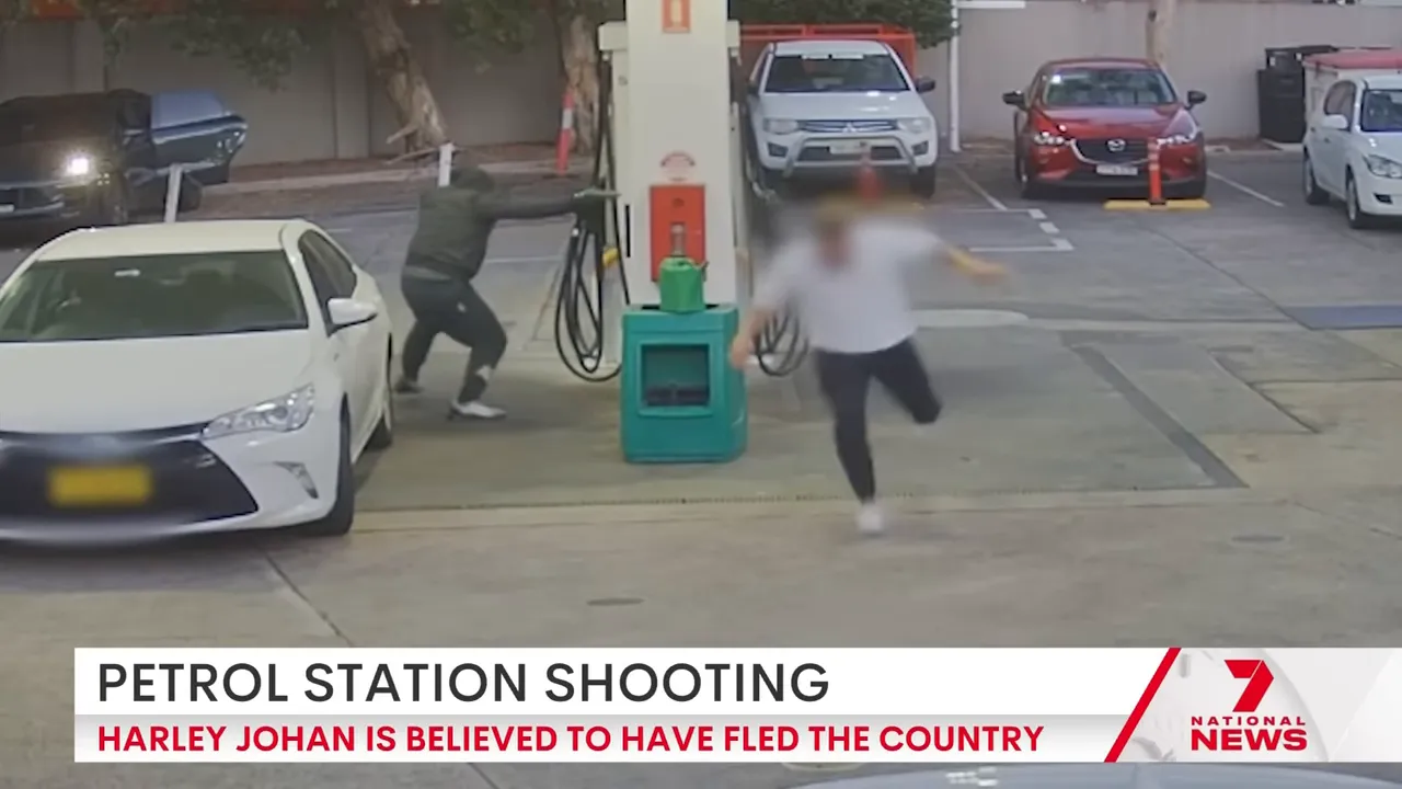 Security camera still showing the moment gunman opens fire at the BP station