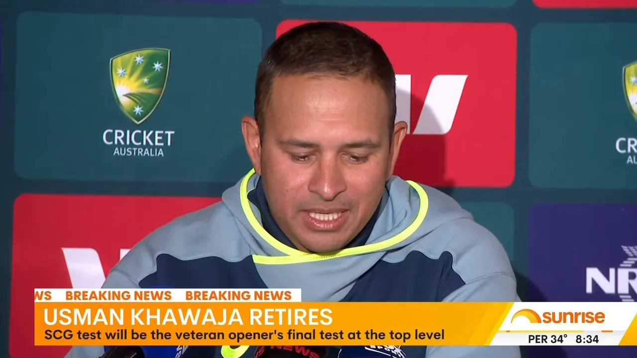Cricketer at a press conference with Cricket Australia branding in the background and a retirement news banner below.