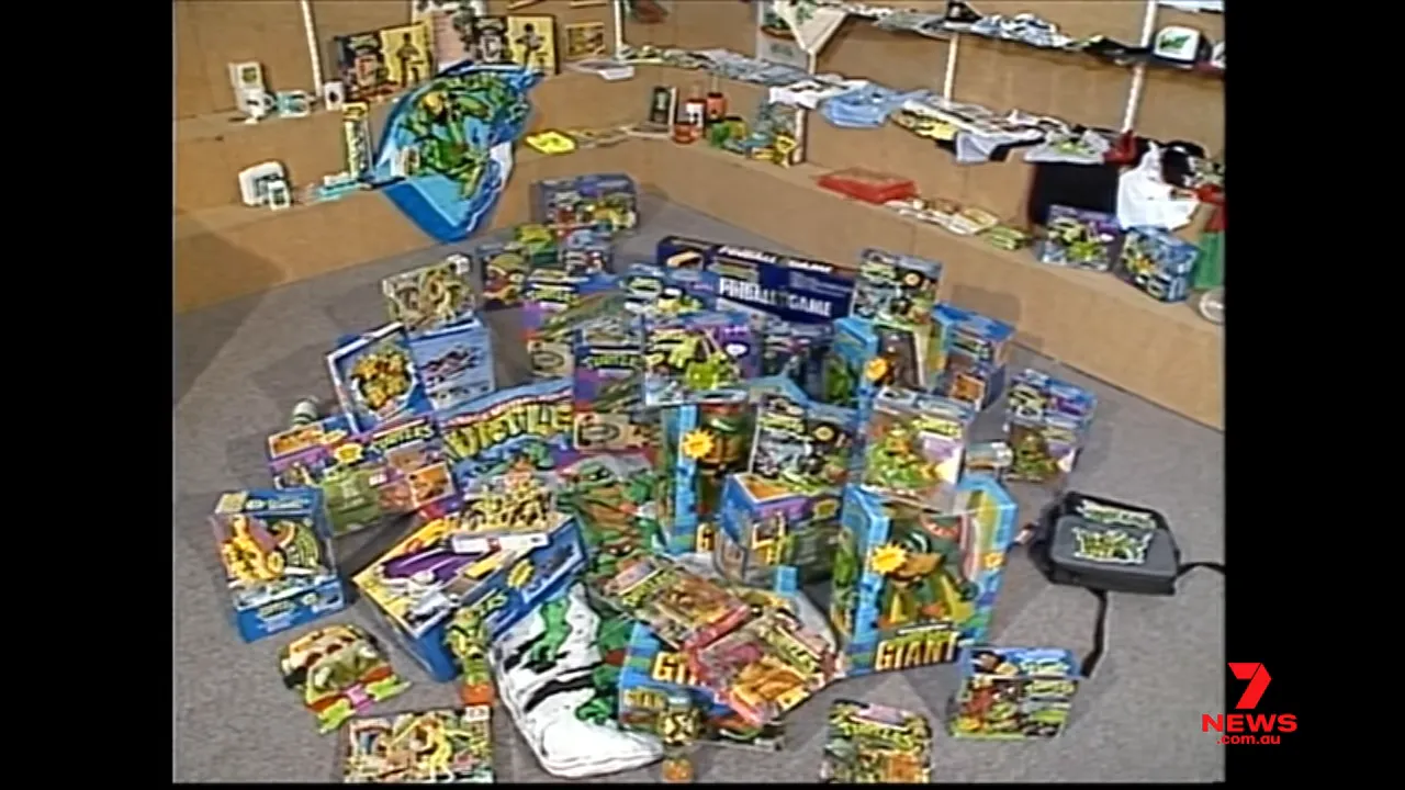 Large display of Teenage Mutant Ninja Turtles toys and packaged merchandise arranged together in a store