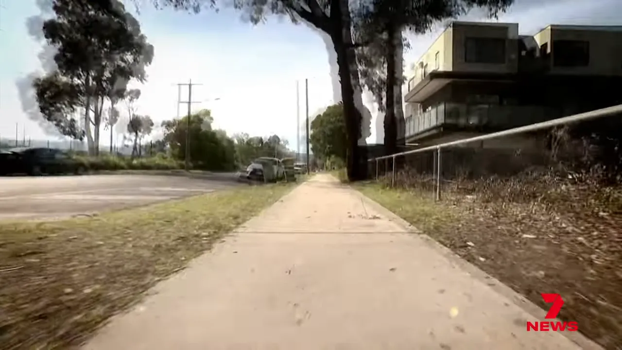 The injured man running along Station Street, holding his side