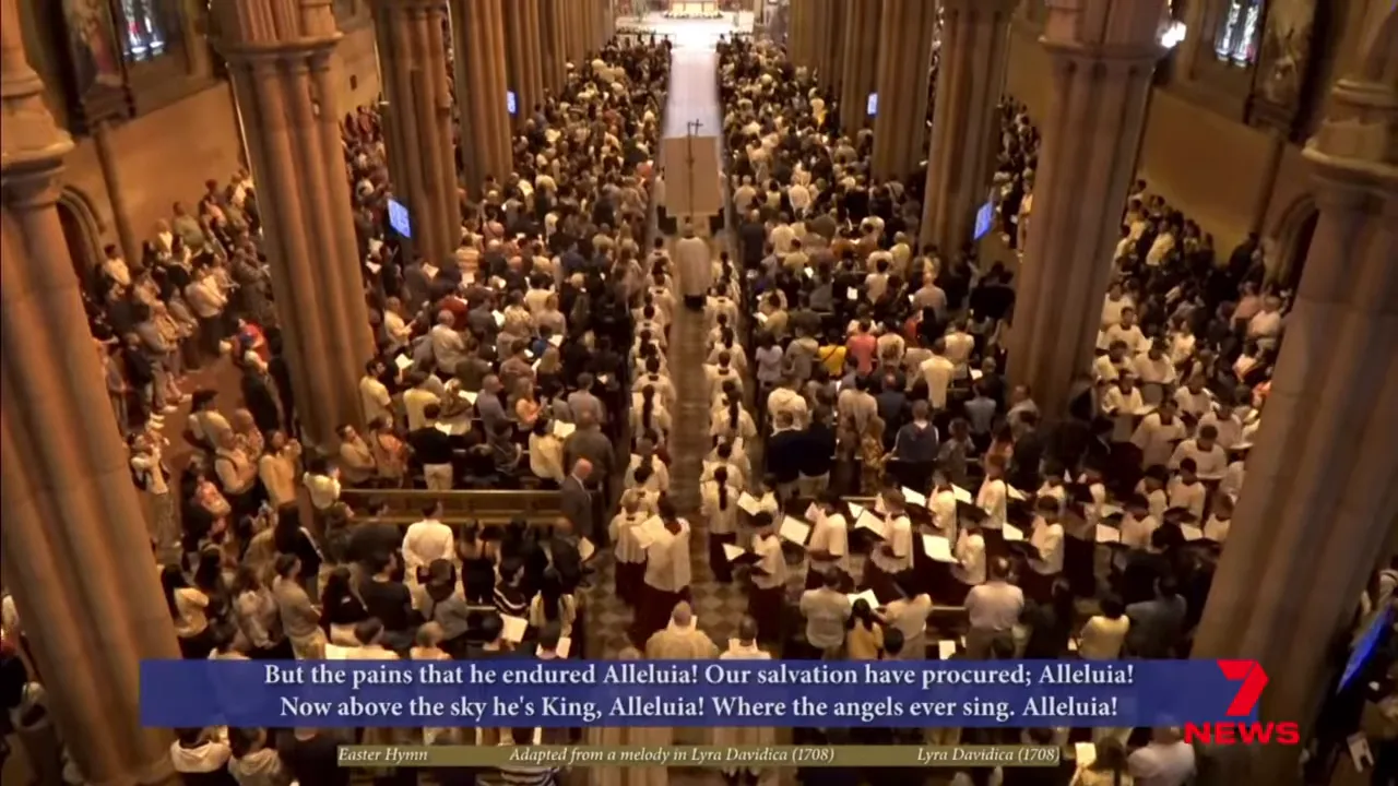 Large congregation standing together during Easter Sunday service in a Sydney cathedral