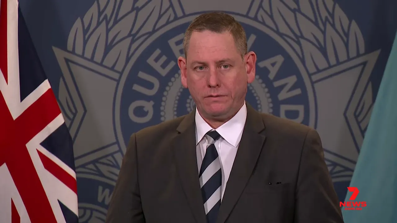 Queensland Police spokesperson speaking at a press conference