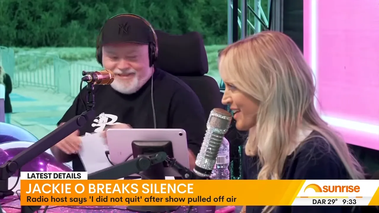 Two radio hosts speaking into studio microphones with a 'Latest Details' news chyron