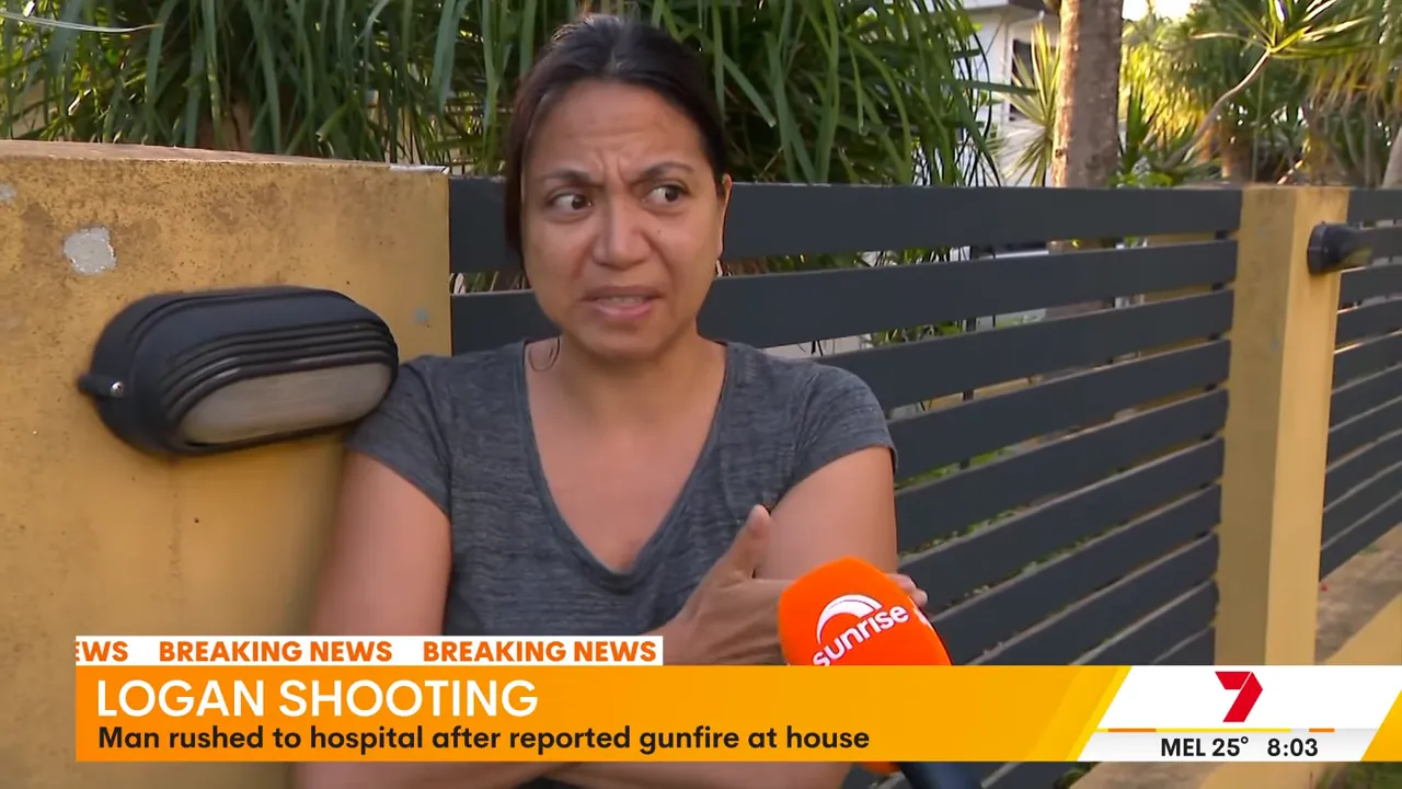 Local resident being interviewed outside a fenced Slacks Creek home with a Sunrise microphone and on-screen 'Logan shooting' banner