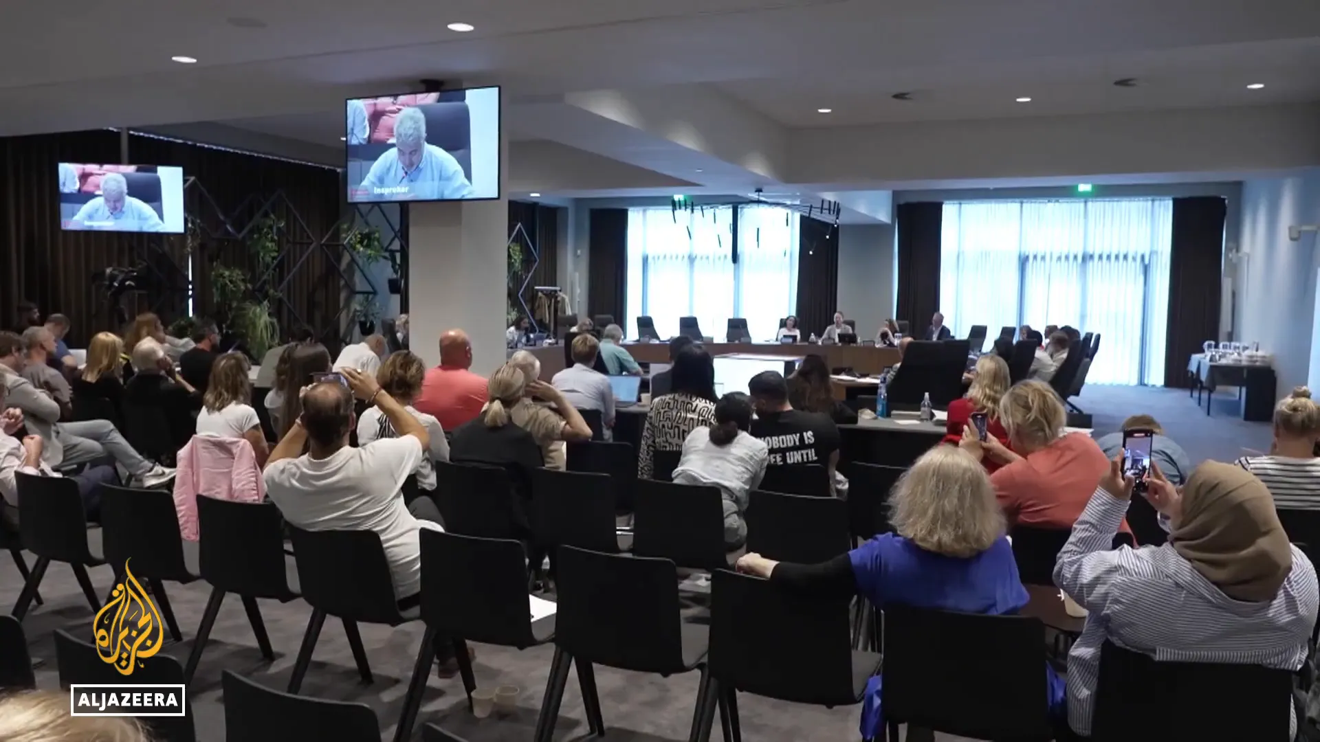 Protestors gathering at Amsterdam city hall demanding justice