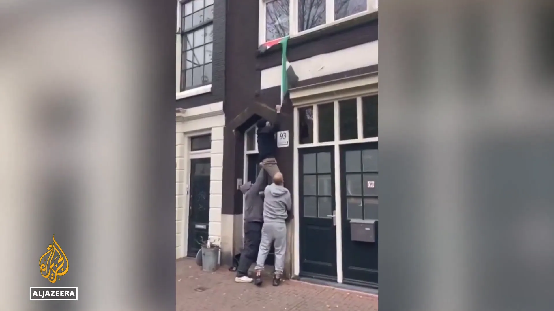 Israeli fans tearing down Palestinian flags at Amsterdam station