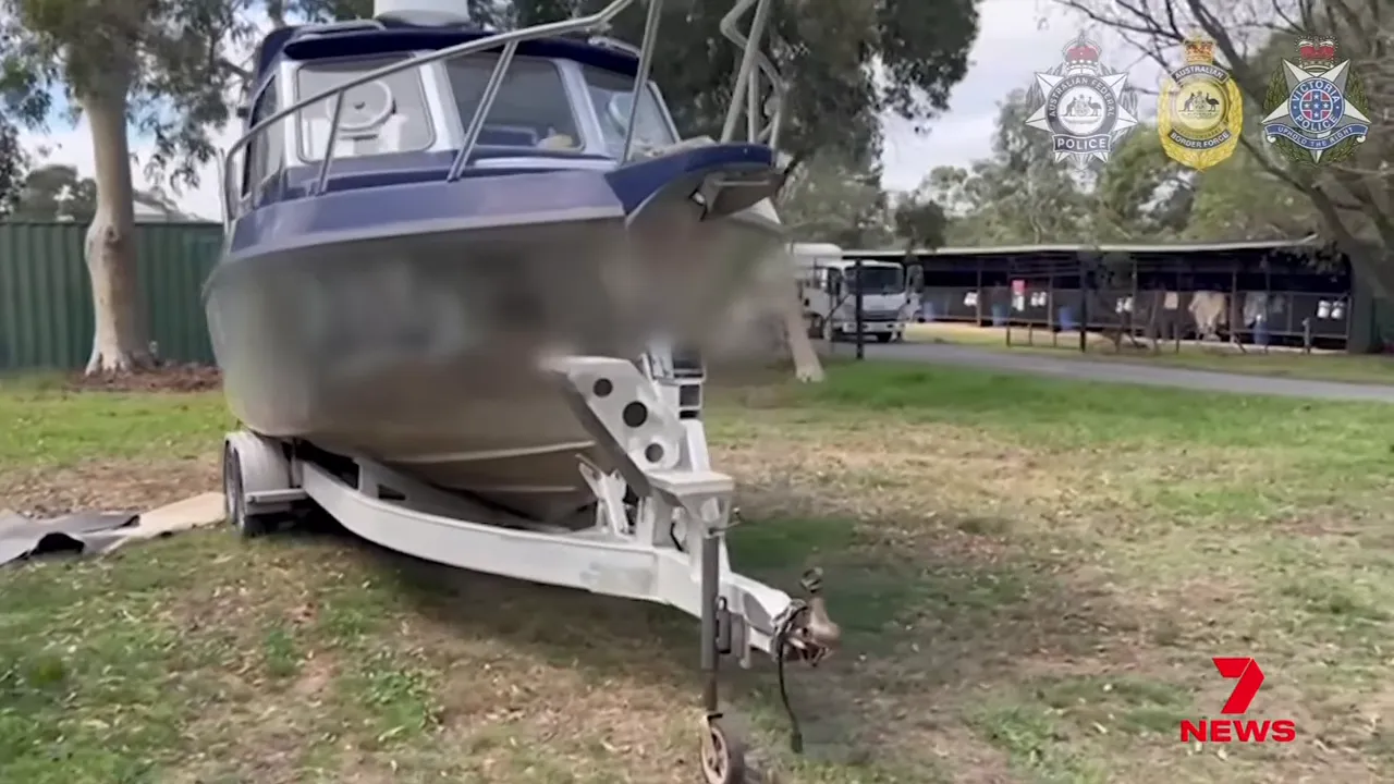 Front view of a beached commercial-style vessel used in investigation footage