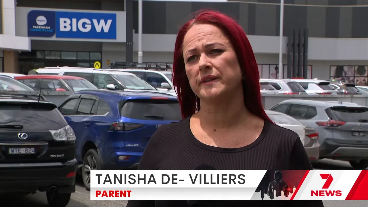Woman being interviewed outside the Big W store at Pakenham Marketplace