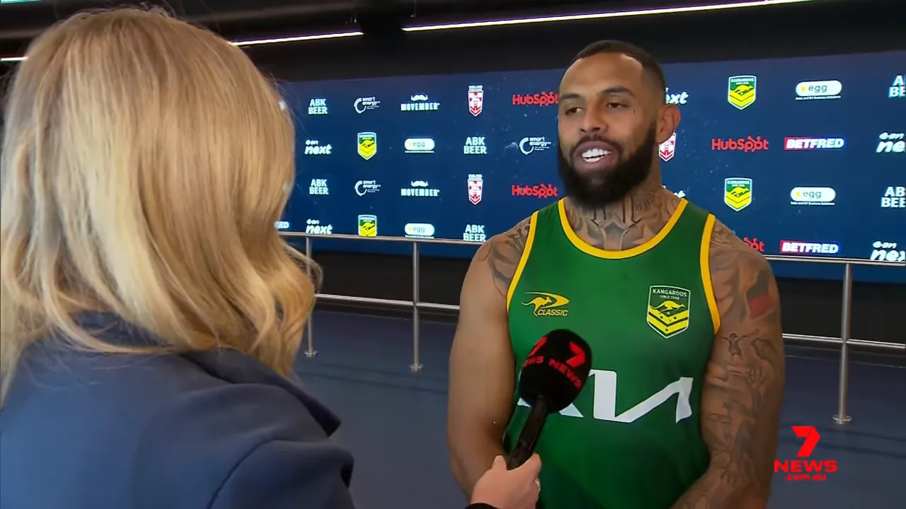 Josh Addo‑Carr wearing the Kangaroos jersey, smiling for cameras