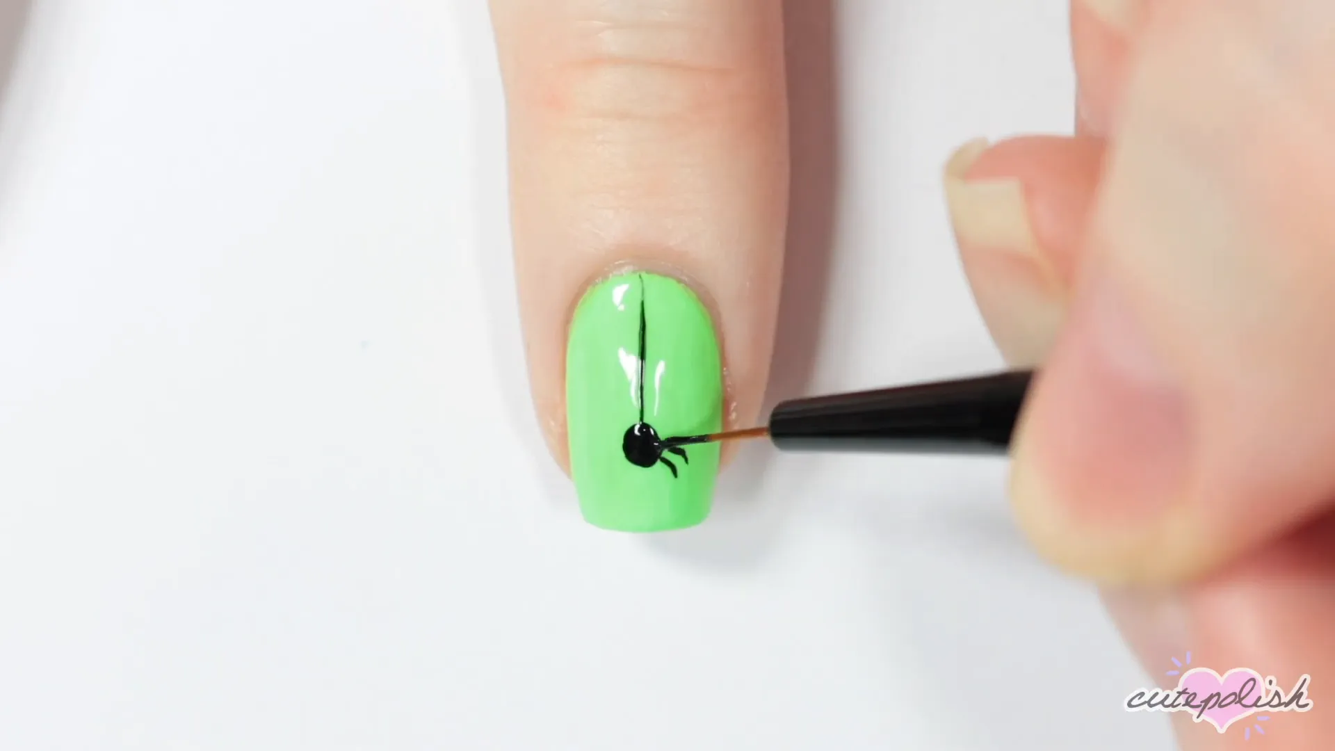 Spooktacular Nail Art: 10 Easy Halloween Designs 10 Adding legs to the spider design.