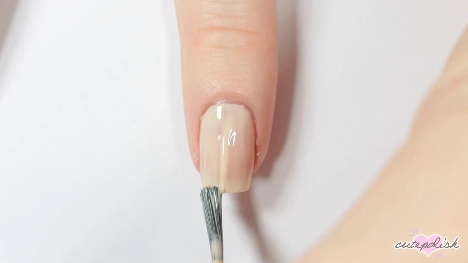Spooktacular Nail Art: 10 Easy Halloween Designs 13 Starting the mummy design with a beige base and black stripe.