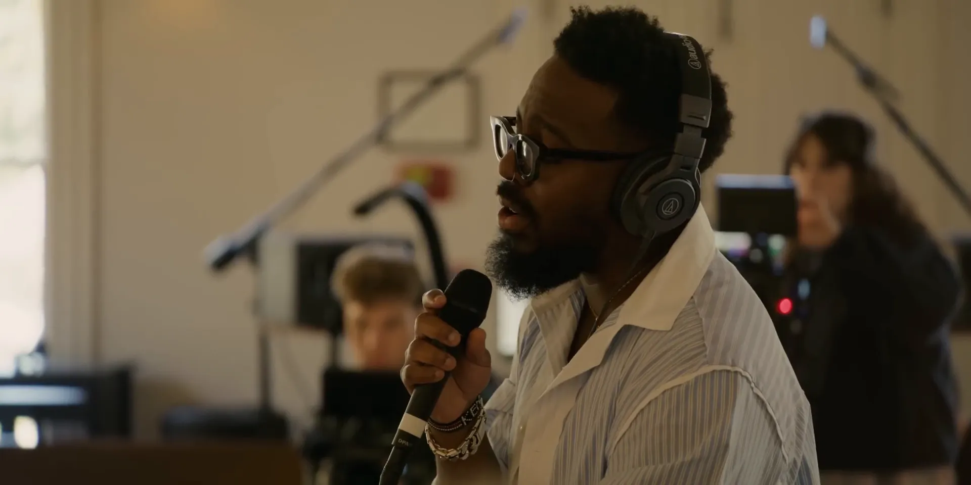 Close-up of worship leader holding microphone during live worship