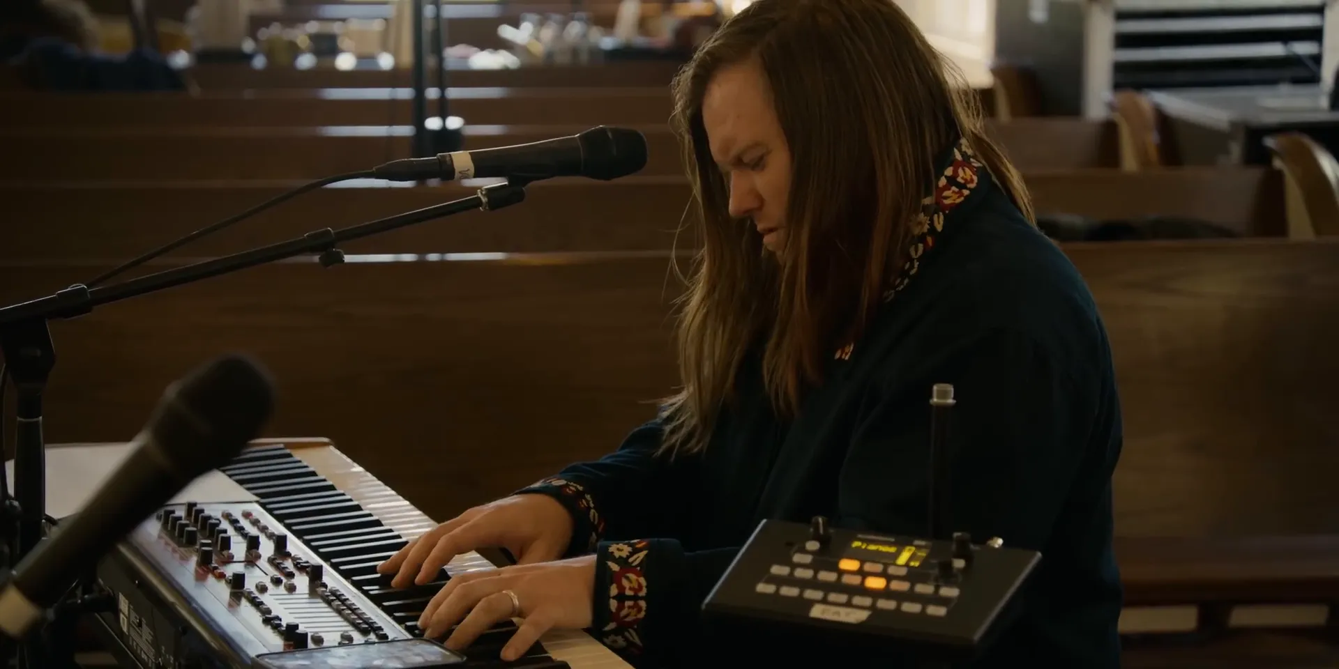 Sons of Sunday vocalist passionately singing during worship