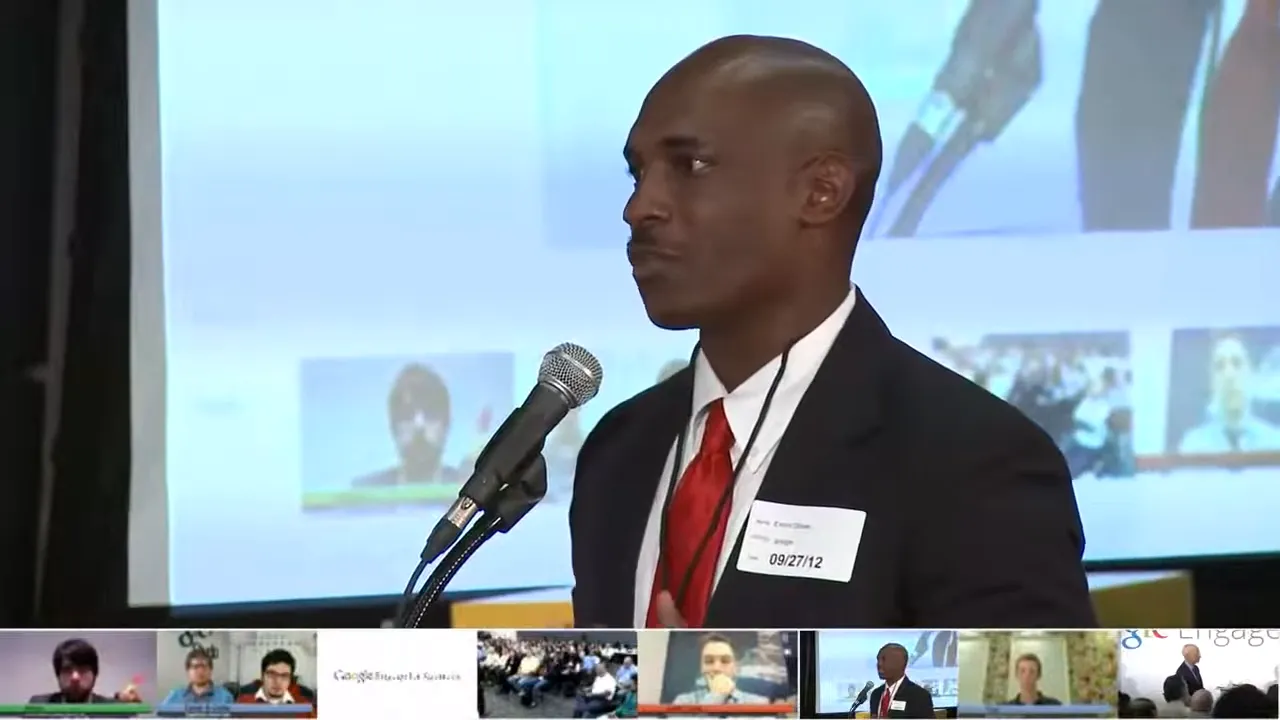 Rico Glover in a red tie at Google's NYC HQ during Seth Godin training