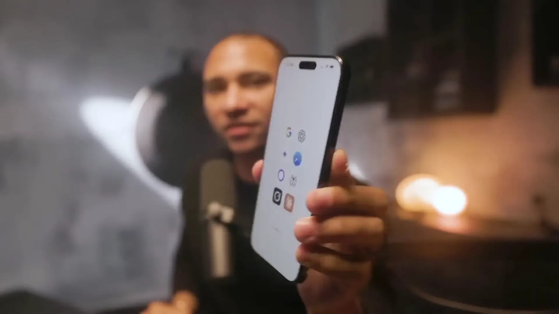 Dom showing his iPhone screen with multiple AI tools