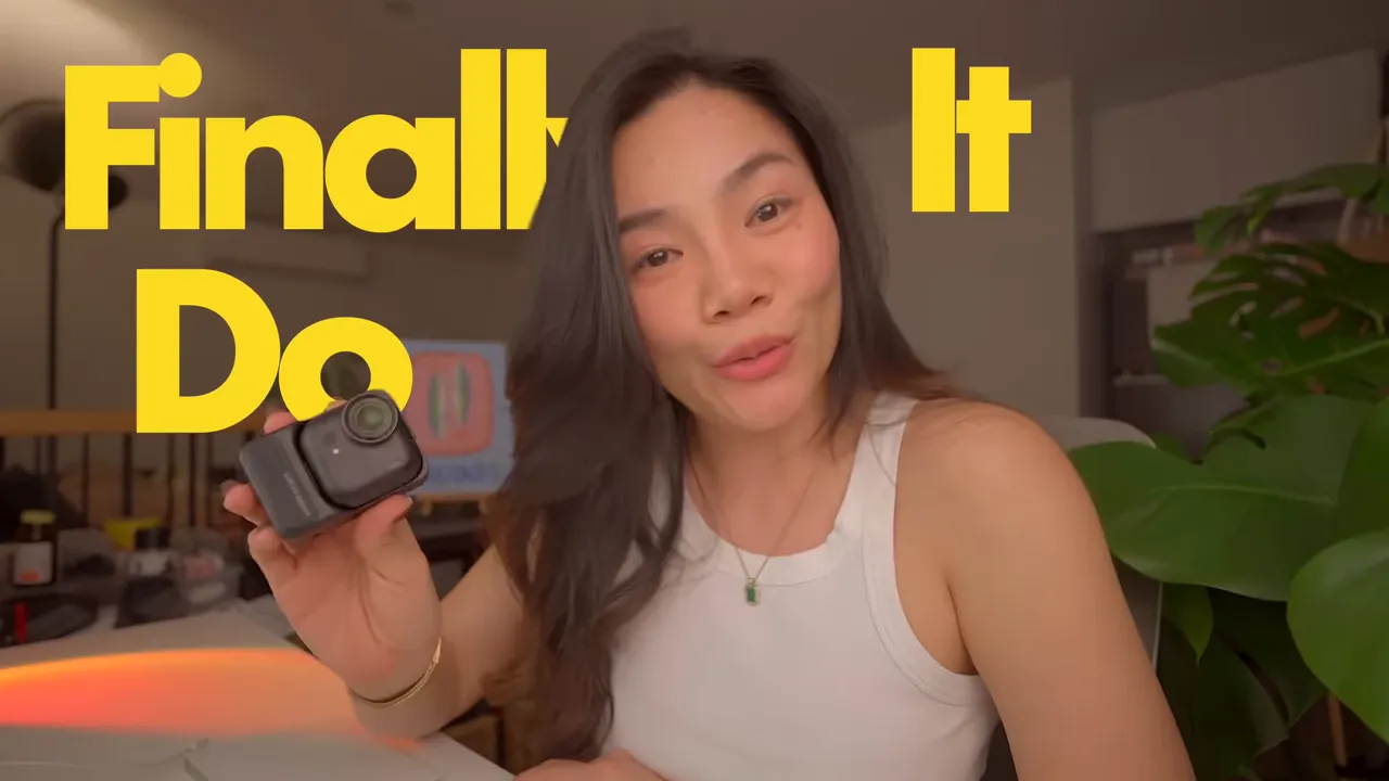 Presenter holding a compact insta360 X5 Ultra camera up to the lens