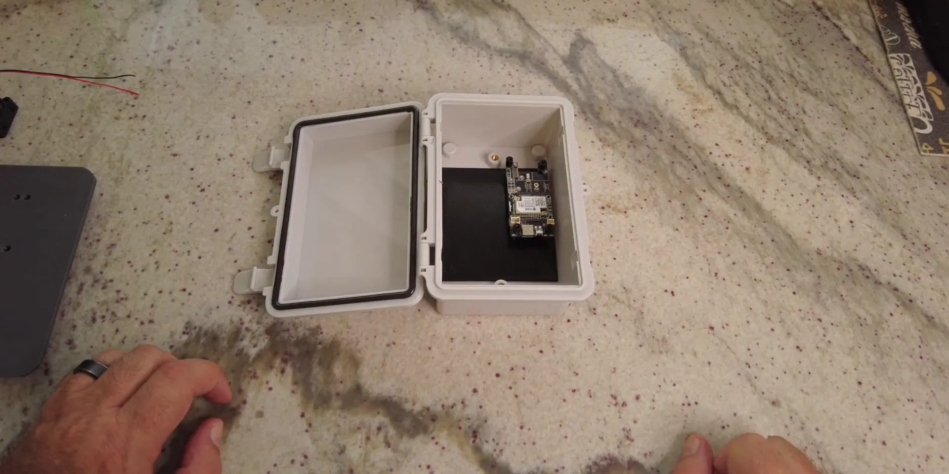 3D printed backplate installed inside waterproof case with WisBlock mounted