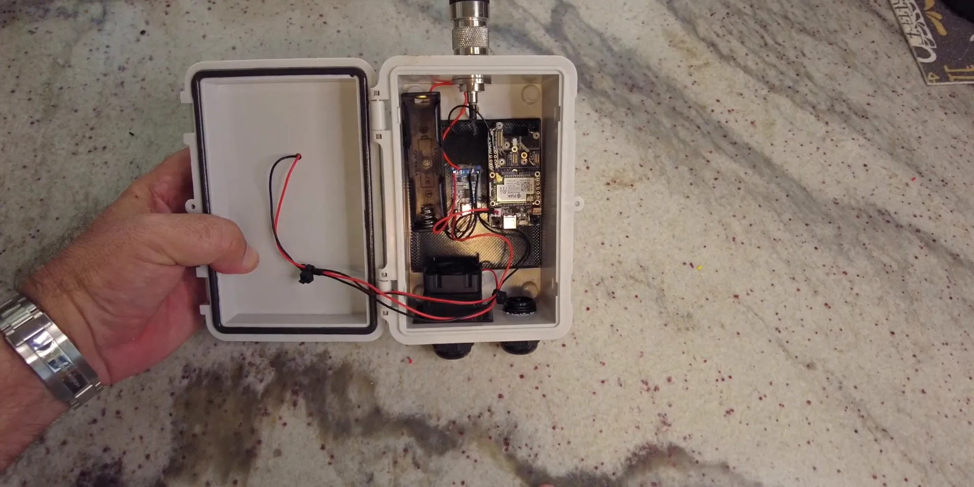 Fully assembled solar node with battery, charge controller, and fan wiring