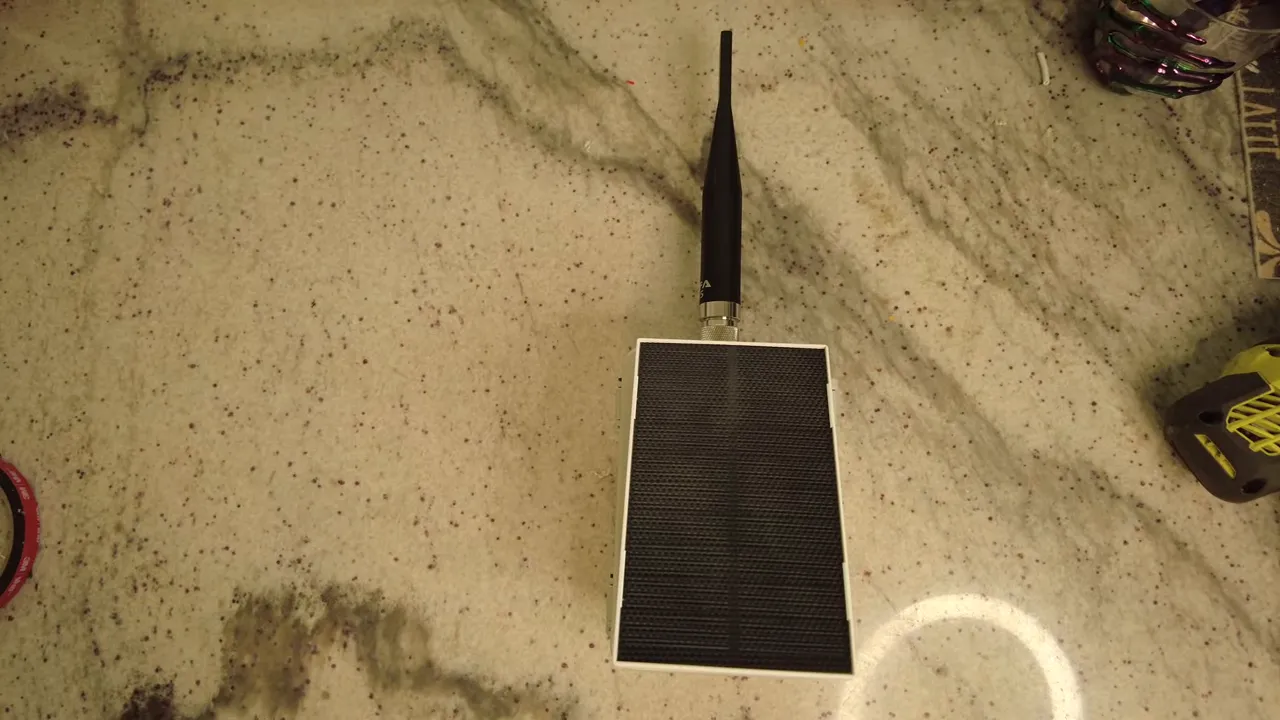 Final assembled Solar Meshtastic node in its waterproof case with panel mounted