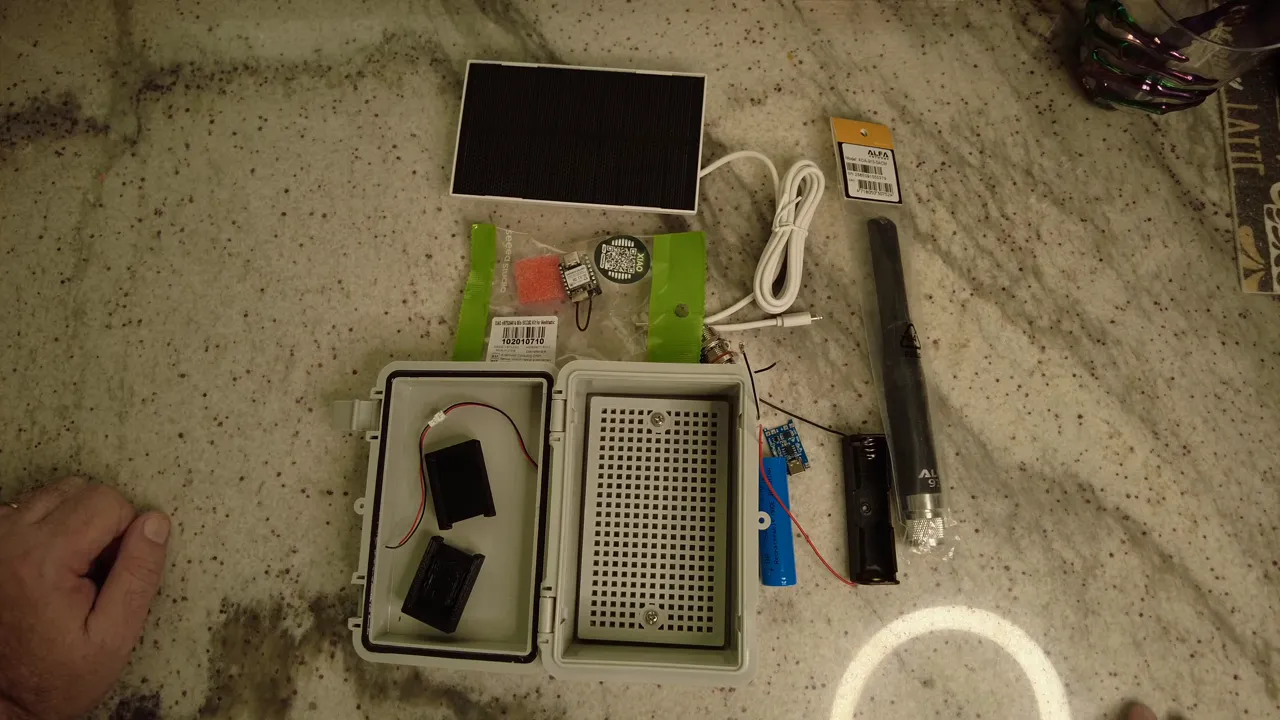 Seed Meshtastic kit and waterproof case laid out