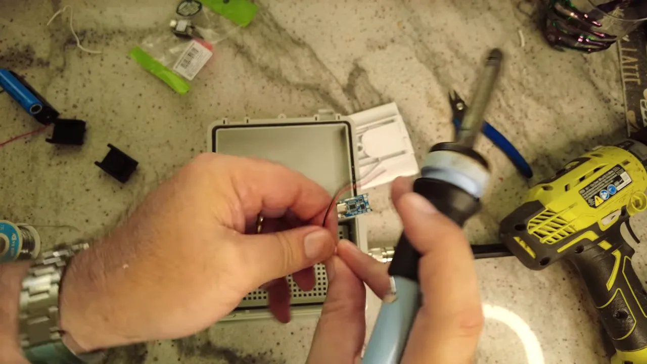 Soldering the solar wires onto the MPPT charge controller