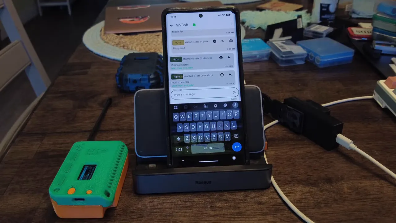 Phone showing Meshtastic message list with channel badges and a green sensor device on the table
