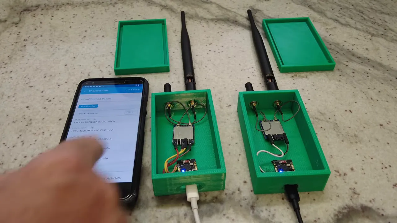 Two RYLR999 bridge nodes side by side with wiring visible and phone app ready to read incoming Bluetooth LE messages