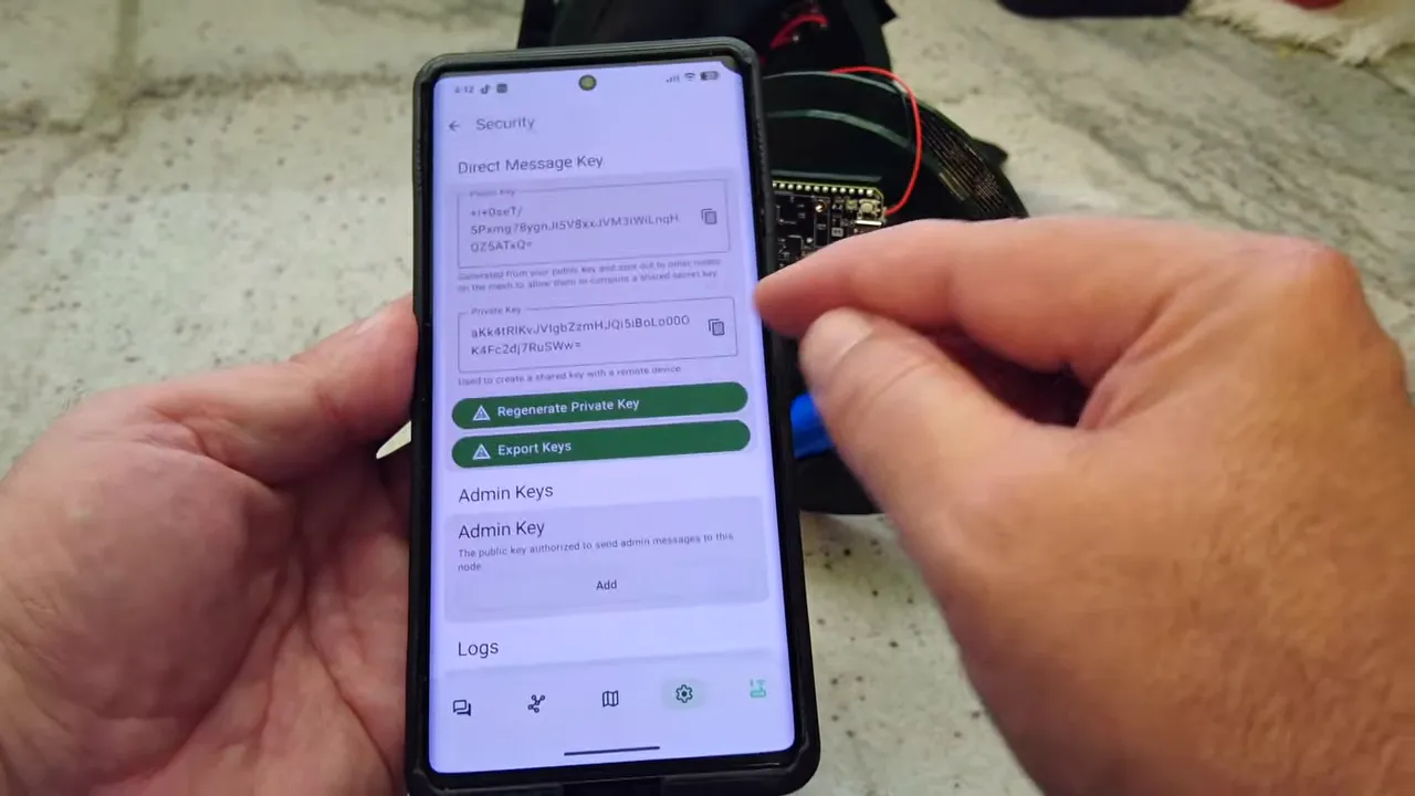Phone showing Meshtastic security screen with admin key and direct message key entries