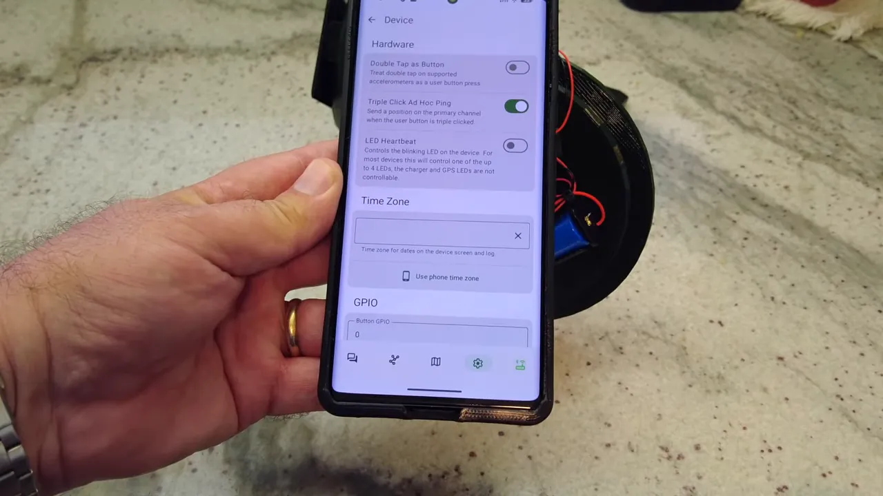 Meshtastic device settings screen on a phone showing LED heartbeat, time zone, and GPIO