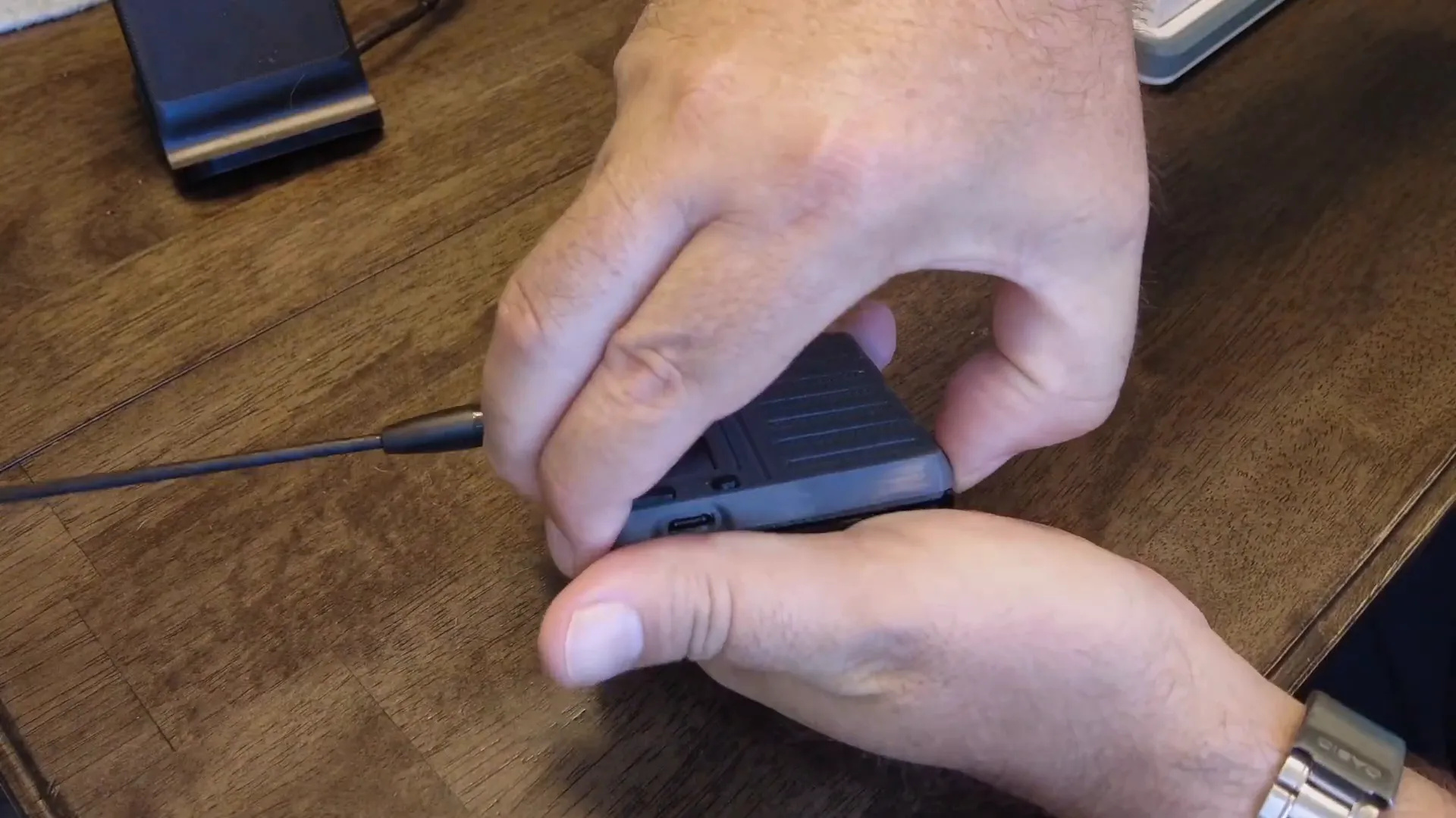 Opening the case to reveal the Heltech T114 and solar panel wiring