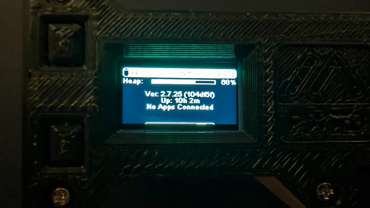 Digital multimeter reading 2.84 volts next to the AA-powered Heltec node