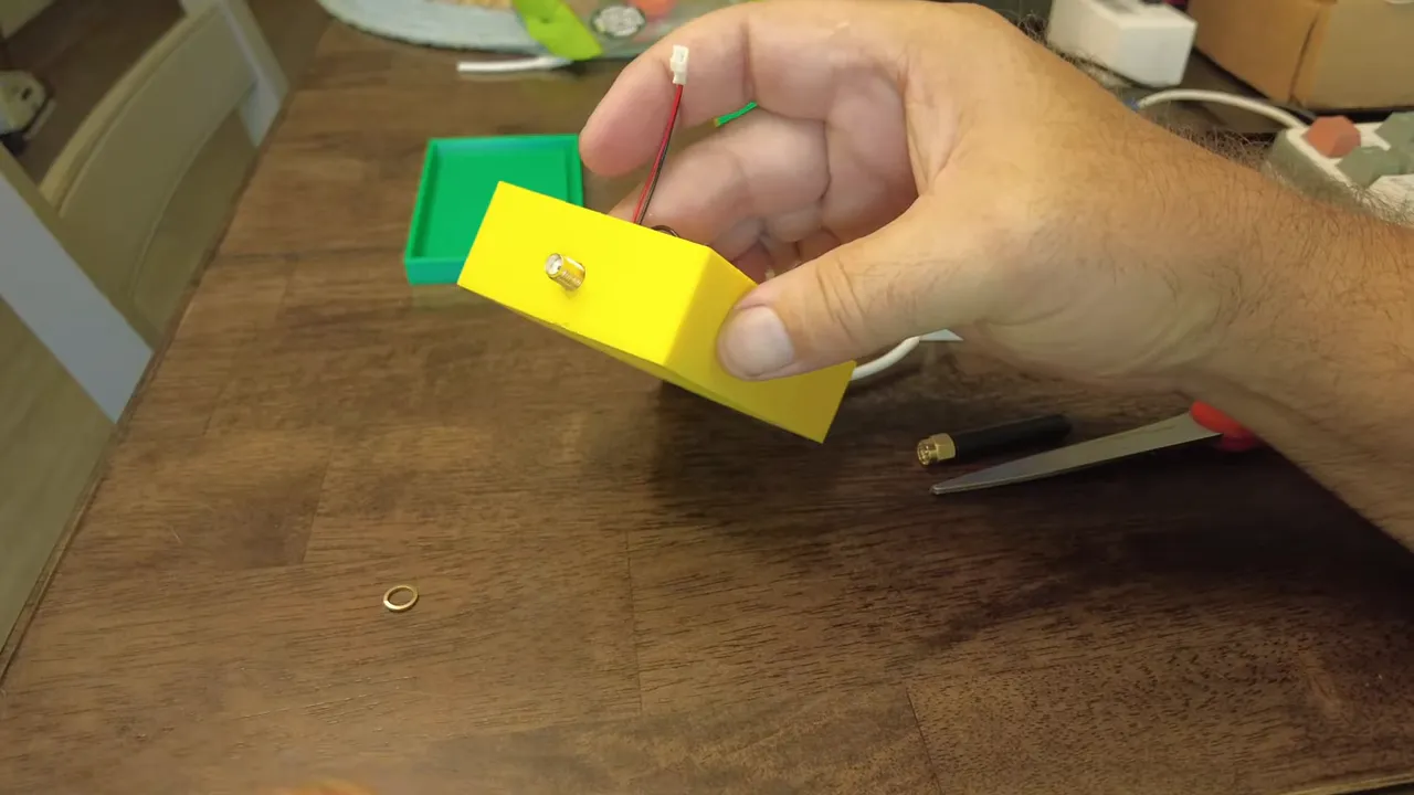 Antenna pigtail being mounted through the case