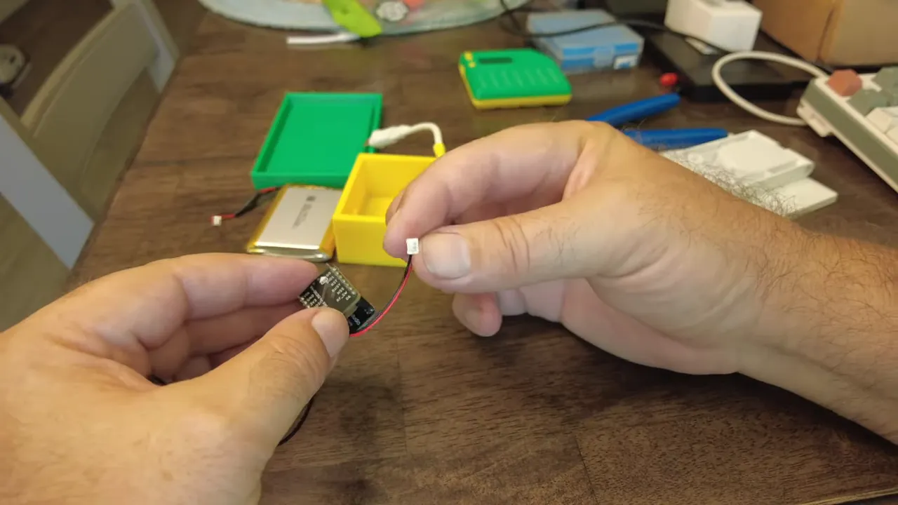 Soldering a tiny power connector to the battery pads