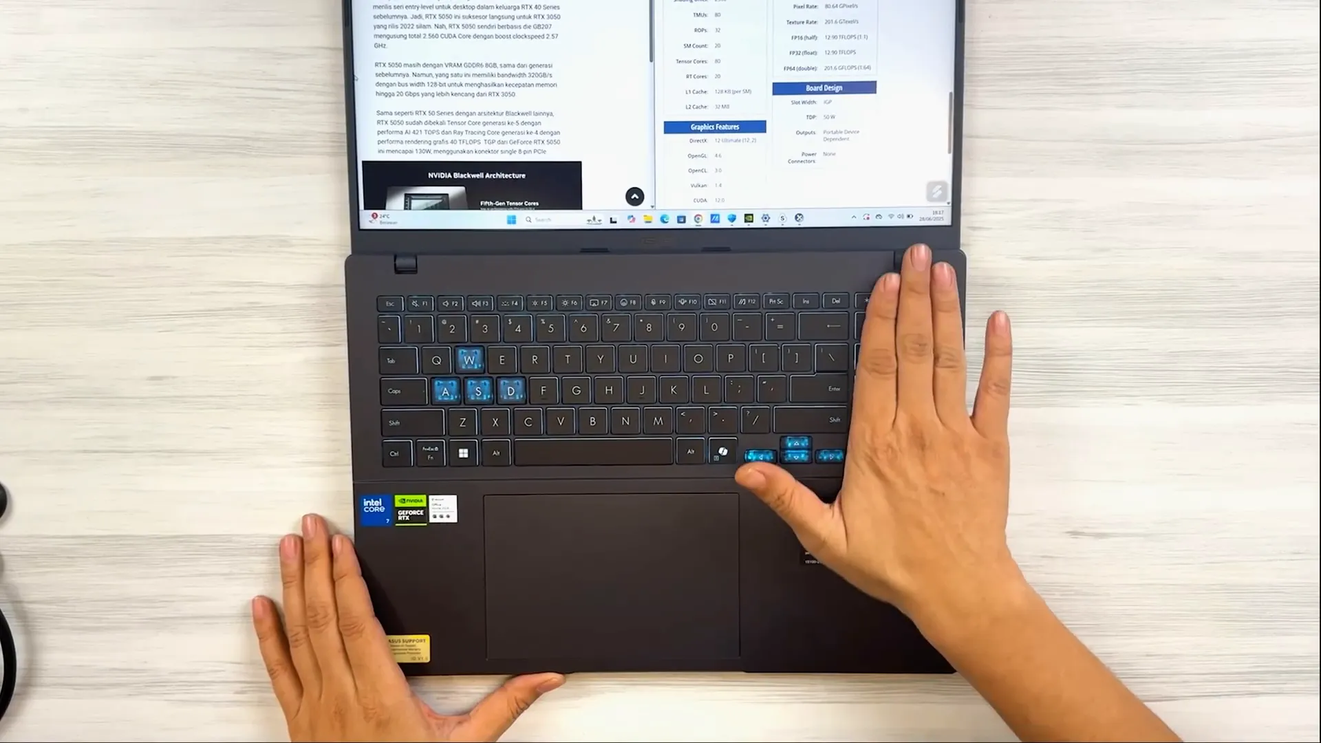 Keyboard Asus V16 dengan backlit biru tembus ke angka