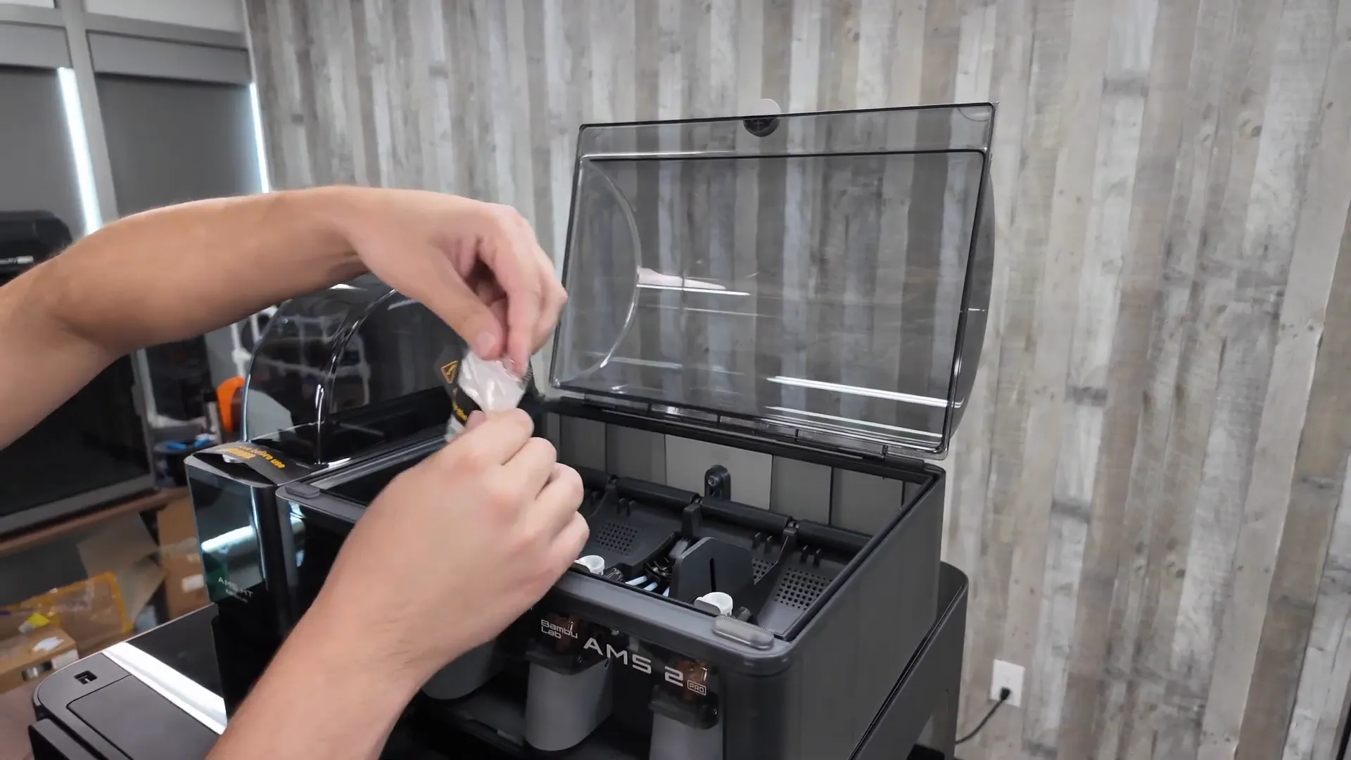 Placing desiccant packs into AMS and AMS HT, then connecting cables