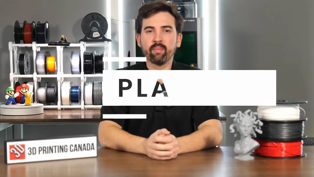 Video frame showing a large PLA title overlay with the presenter and filament spools behind it.