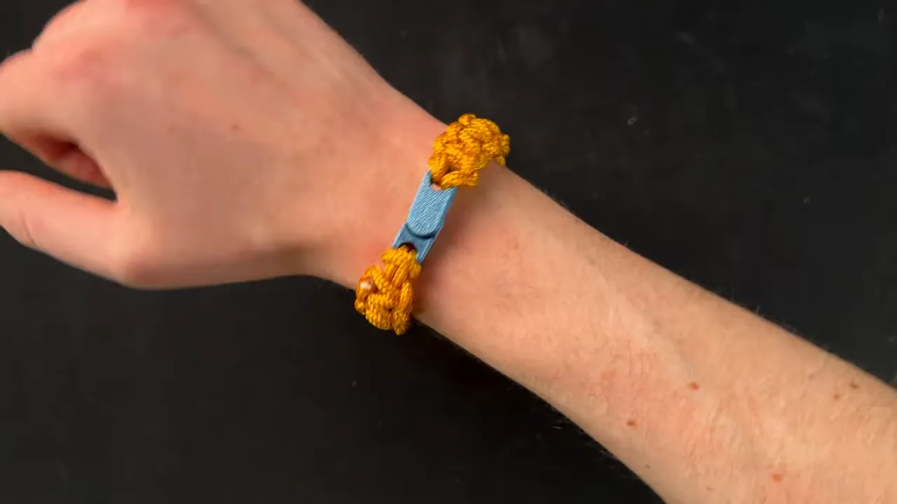 Magnetic bracelet clasp on a wrist showing the finished wearable