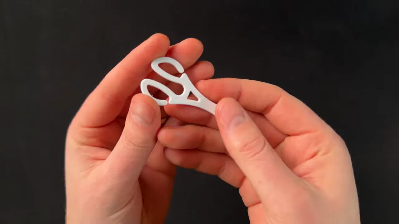 Close-up of a 3D printed shopping cart key hinge profile