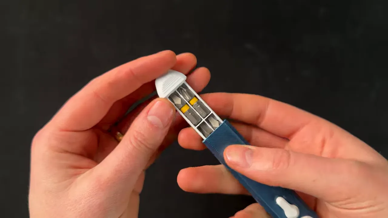 Close-up of 3D printed pocket ratcheting screwdriver bit storage mechanism
