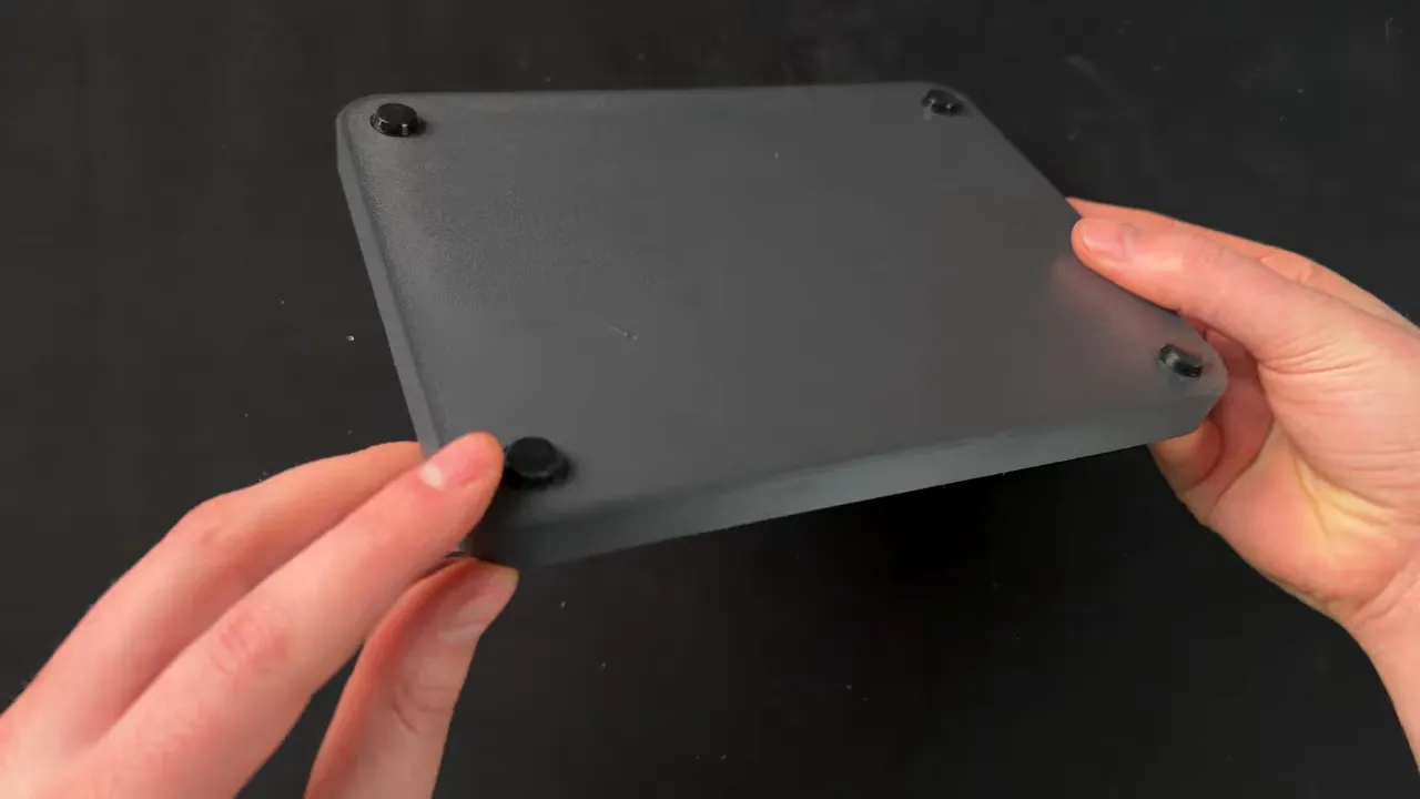 Bottom view of 3D printed EDC catch-all tray showing small feet or mounting points