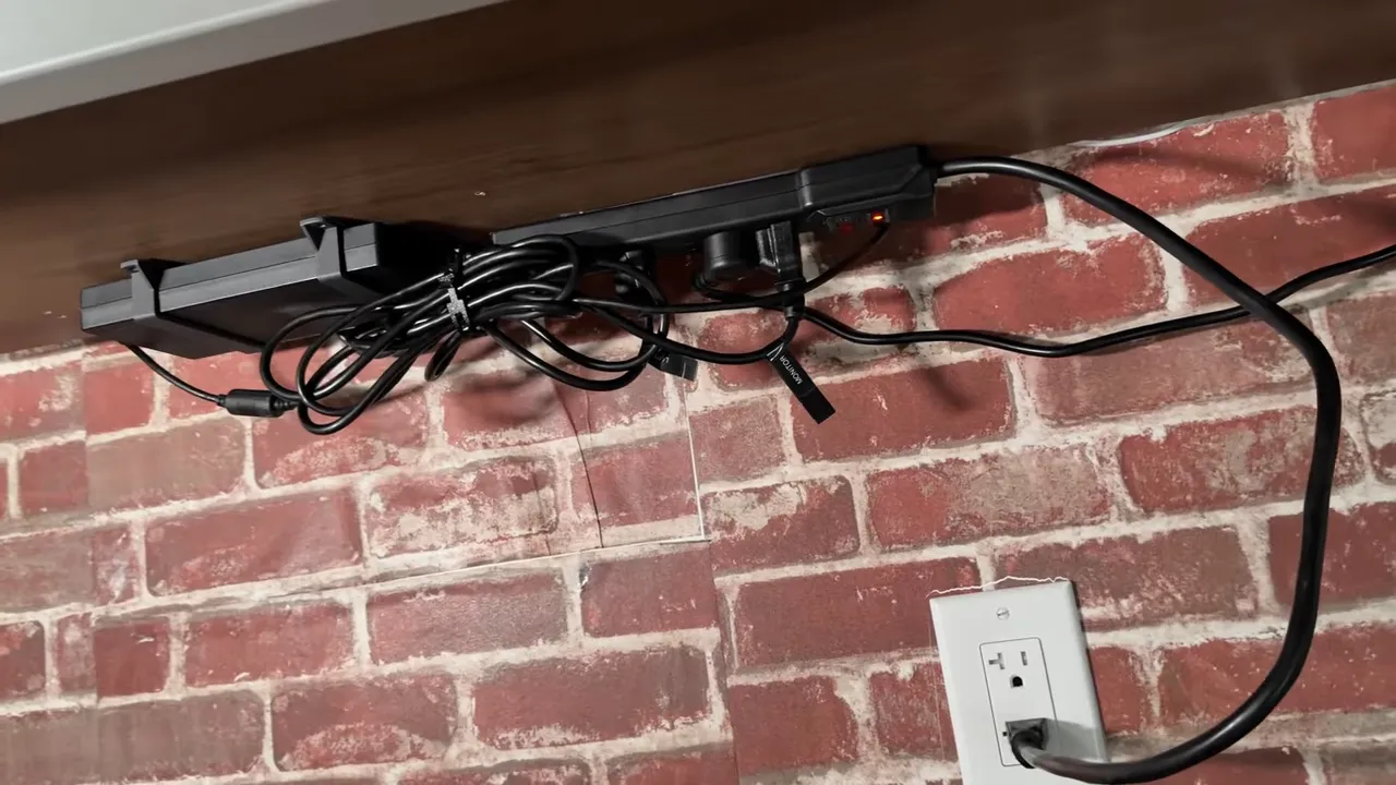 under-desk power strip with bundled cables and cable clips