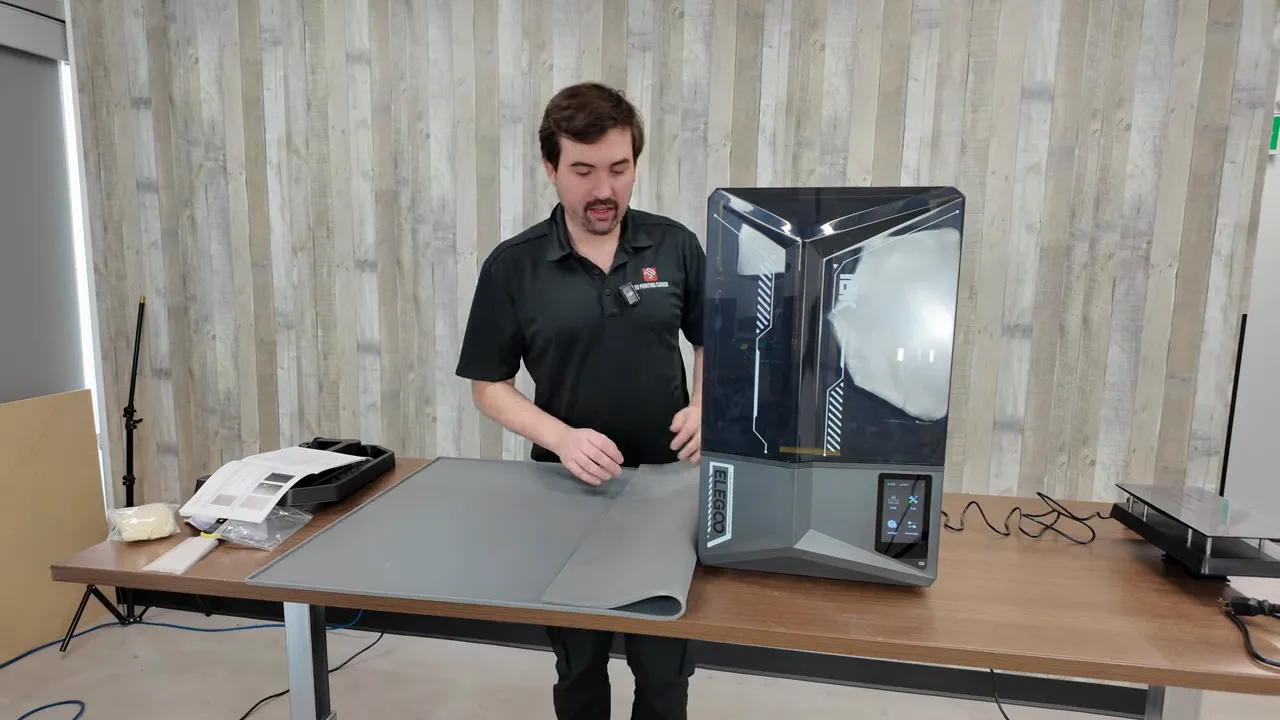 Protective mat under printer to prevent resin spills