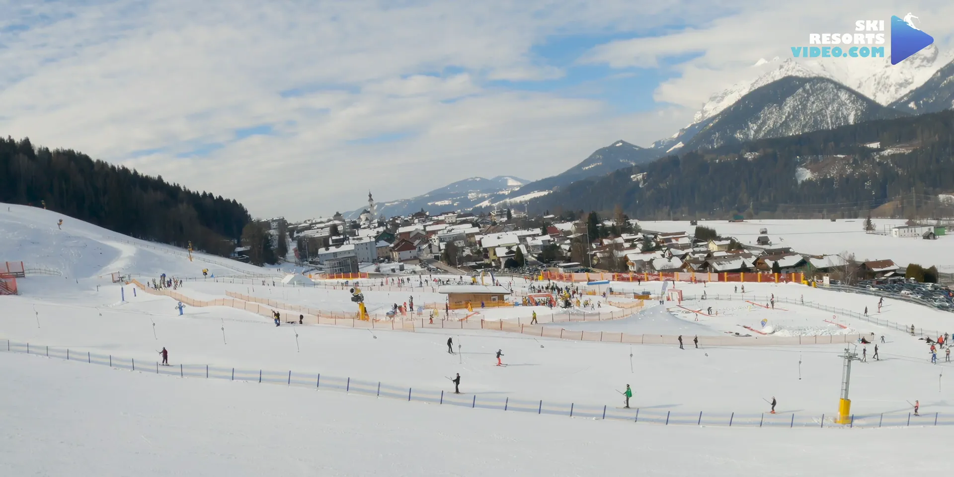 Children learning to ski on gentle fun slopes